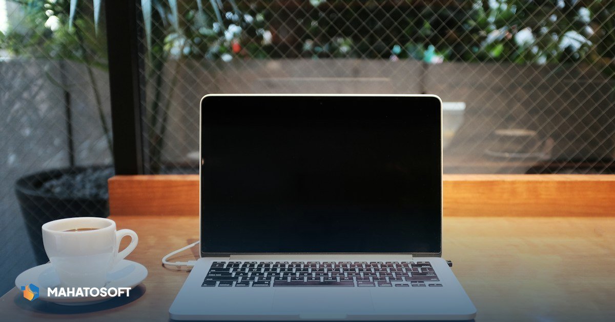 WordPress white screen of death — developer looking at a completely blank website page on a laptop
